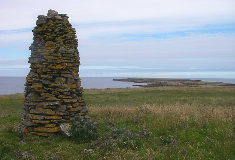 Cairn overlooking Holms of Ire, Burness, Sanday by Alan Bowring